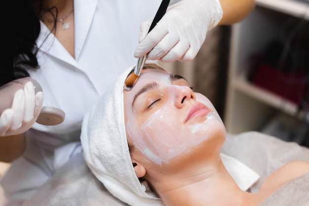 A woman getting a facial in a salon