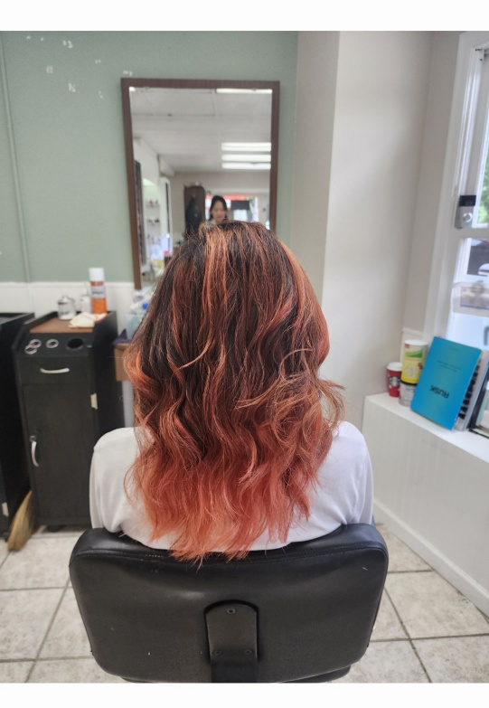 Woman in a salon after getting her hair colored