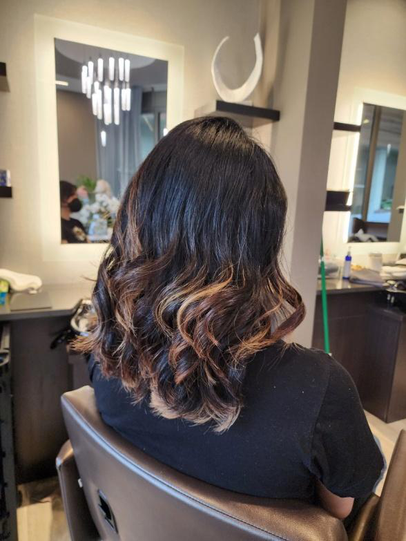 A woman sitting in a salon