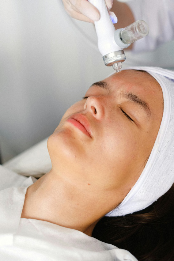 A woman getting an ultrasound facial