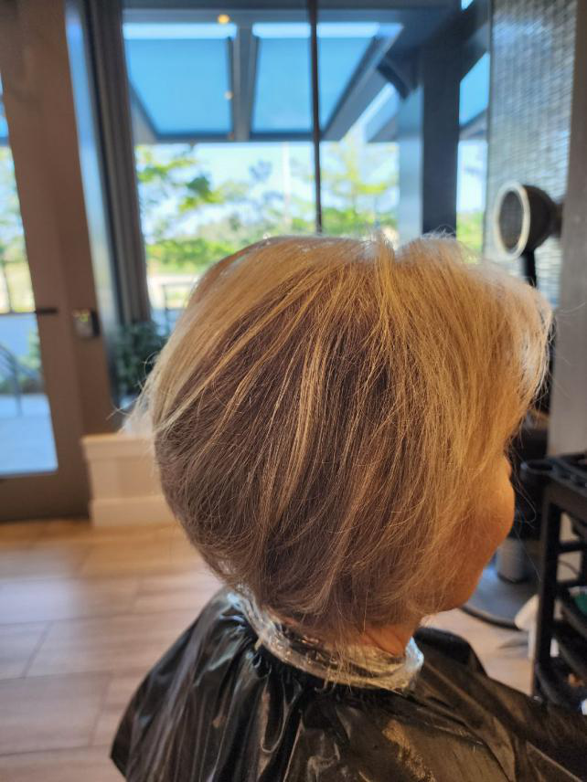 A woman sitting in a salon